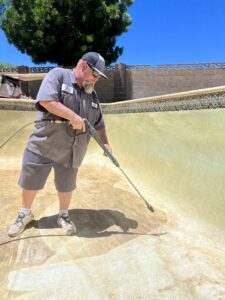Mike Shaughnessy powerwashing a pool