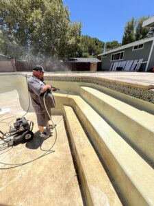 Mike Shaughnessy powerwashing a pool